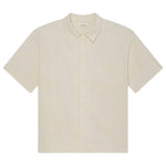 The Frame Jacquard Cotton Short-Sleeved Shirt features a breathable cream cotton fabric, subtle vertical stripes, button-up front, and chest pocket—an essential summer piece laid flat on a white background.