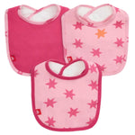 The Magnetic Me Cosmic Confetti with Foil Modal Bib 3-Pack includes one solid pink modal bib and two magnetic bibs with pink and orange star patterns.
