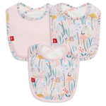 The Magnetic Me Shroom and Bloom Modal Bib 3-Pack includes three bibs: one solid pink and two with pastel floral and animal prints, all featuring rounded edges and a small red tag on the side.