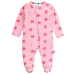 The Magnetic Me Baby Girls' Cosmic Confetti with Foil Modal Footie is a pink long-sleeve onesie with covered feet, red and purple star pattern, and magnetic closures for quick changes.