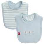 The Magnetic Me Stripe Organic Cotton Bib with Emb. set includes one bib with light blue and white stripes and one solid light blue bib featuring three embroidered sheep, both made from soft organic cotton for baby’s comfort.