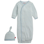 The Magnetic Me Baby Stripe Organic Cotton Gown & Hat features a light blue and white striped newborn gown with long sleeves, paired with a matching top knot hat.