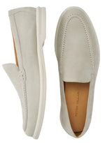 Top view of the Excursionist Venetian Loafer by Peter Millar, a pair of light gray slip-on loafers with minimalist design and visible stitching. Made from nubuck, these shoes blend elegance and comfort, ideal for any occasion.