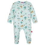 The Magnetic Me Baby Modal Footie is a light blue sleepsuit with long sleeves and covered feet, made from eco-friendly TENCEL™ modal. It features tree, lion, bear, and panda prints with snap buttons down the front.