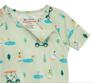The Baby Modal Pajama Short Sleeve Set by Magnetic Me is a green onesie adorned with golf-themed illustrations like golfers, flags, and trees. Made from eco-friendly fabric with TENCEL™ modal, it's ideal for babies aged 9-12 months (19-22 lbs).