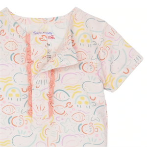 Close-up of the Modal Short Sleeve Short Set with Ruffle by Magnetic Me, made from eco-friendly TENCEL™. It features a pastel ocean-themed pattern with whales, fish, sun motifs, and a charming ruffled buttoned placket.