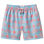 Pink House Mustique Swim Trunk: Light blue swim shorts with pink palm tree and pineapple print, made from recycled plastic. Features elastic waistband, white drawstring, quick-dry fabric, and mid-thigh length.