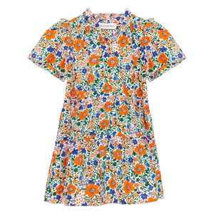 The Girls' Merritt Dress by Hunter Bell NYC features short sleeves, an orange, blue, and green floral print, ruffled neckline, fitted waist, and an above-the-knee hem.