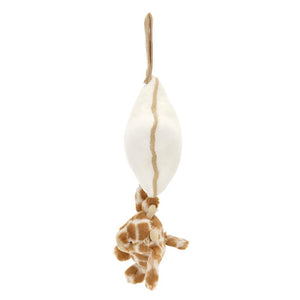 The Jellycat Bashful Giraffe Musical Pull toy, made from recycled fibers, hangs upside down by a white rope connected to a bean-shaped object.