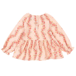The Konges Slojd Baby Girls' and Girls' Coco Blouse features light pink muslin, a floral print, long sleeves with ruffled cuffs, front buttons, and a flared waist—combining comfort and style.