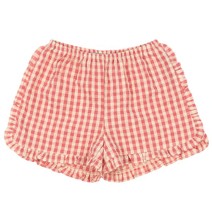 The Konges Slojd Girls' Kim Frill Shorts feature red and white gingham checks, an elastic waistband, and ruffled hems with decorative frills, shown laid flat on a white background.