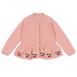 The Konges Slojd Baby Girls' and Girls' Cypres Cardigan is a light pink knitted cotton cardigan with long sleeves, mother-of-pearl buttons, a ruffled hem, and embroidered cherries at the bottom.