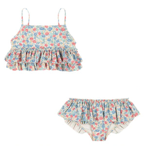 The Konges Slojd Baby Girls' and Girls' Manuca Frill Bikini is a two-piece swimwear set with frill details, featuring red, blue, and green floral prints on a light background.