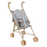 The Konges Slojd Doll Stroller is a lightweight beige stroller with a floral-patterned seat and four pairs of double wheels, designed for children to push dolls or stuffed animals.
