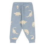Konges Slojd Baby Boys' and Boys' Lapis Knit Pants feature a light blue jacquard knit with an elastic waist, drawstring, relaxed fit, and beige dinosaur silhouettes throughout.