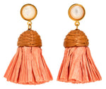Elevate your jet-setter style with Lizzie Fortunato's Raffia Earrings: gold-plated tassels, pearl-like studs, woven caps, and vibrant coral fringes add summer elegance to any outfit.