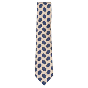 The Amoeba Tie by Robert Jensen is a beige silk tie featuring a repeating pattern of blue floral or circular motifs.