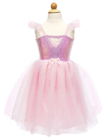 The Great Pretenders Sequins Princess Dress is a pink child-sized dress with a glamorous sequined bodice, tulle skirt, ruffled straps, and a small bow at the waist, shown on a wooden mannequin—ideal for special occasions.
