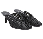The ID Macrame Mule by 3.1 Phillip Lim features black handwoven faux leather, open backs, pointed toes, mid-height heels, and an architectural perforated pattern for a modern heeled mule look.