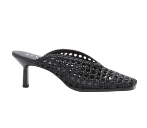 The 3.1 Phillip Lim ID Macrame Mule features a pointed toe, mid stiletto heel, handwoven faux leather, and an open-back architectural design.