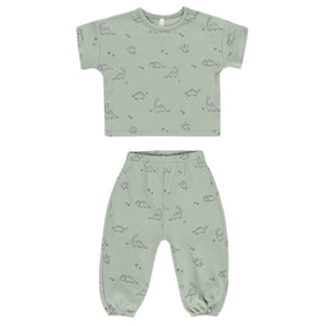 Quincy Mae Baby Boys' Jersey Tee & Pant Set in light green with cute dino print and short sleeves, shown laid flat on a white background.