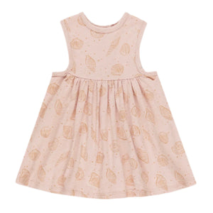 The Rylee & Cru Baby Girls' and Girls' Layla Dress is a sleeveless, light pink cotton jersey dress with a gathered skirt and subtle tan seashell print—all for ultimate comfort.