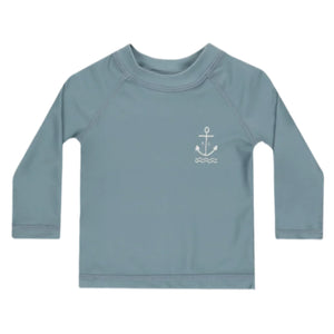 The Rylee & Cru Baby Boys' and Boys' Long Sleeve Rashguard features a light blue color, small white anchor and wave design on the left chest, UPF 50+ sun protection—perfect for beach days.