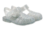 The Igor Clasica Cristal Sandal is a pair of translucent jelly shoes with glitter, Scandi-inspired colors, closed toes, flexible soles, and ankle straps.