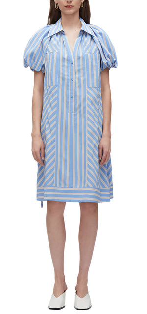 Someone is wearing the Puff Sleeve Stripe Short Shirt Dress by 3.1 Phillip Lim, which is made of technical poplin and features blue and white stripes with puff lantern sleeves, paired with white pointed shoes.