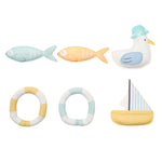 The Dive Buddies Set of 6 by Sunnylife features bath toys to boost water confidence: two fish, one seagull, two lifebuoys, and a sailboat.