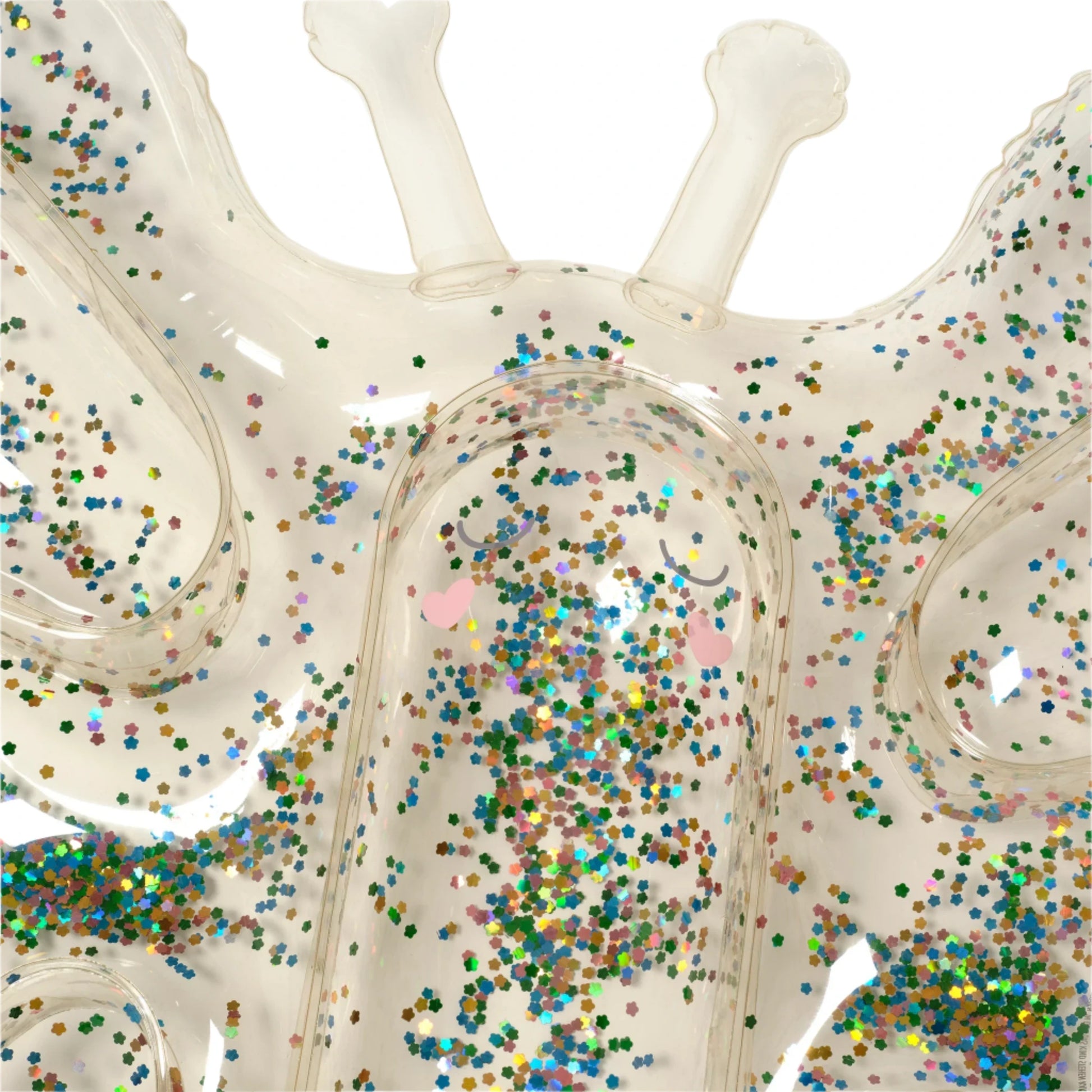 Close-up of the Sunnylife Kids' Lie-On Float Cotton Candy Glitter, a transparent inflatable pool float filled with colorful confetti and featuring two handles at the top.