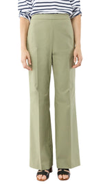 A person shown from mid-torso to feet wears a striped long-sleeve shirt, Ann Mashburn Hutton Stretch Canvas Pant with a flattering waist, and black sandals.