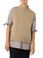 A person wearing the Ann Mashburn Marion Sweater, a beige cashmere sweater vest, layered over a striped button-up shirt with tied sleeves and paired with a black skirt.