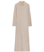 The Showtime Cashmere Shirt Dress by Guest in Residence is a lightweight, beige long-sleeve collared shirt dress with a button-down front, shown laid flat on a white background.