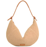 Mansur Gavriel's Fortuna Raffia Bag is a beige woven hobo with a curved design, crafted from soft Italian raffia and featuring a knotted brown leather strap.