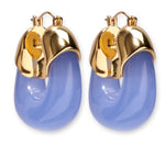 The Lizzie Fortunato Organic Gold Hoops feature shiny gold tops and thick, curved lower sections in bold lavender blue resin for a striking statement look.