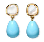 The Rock Pool Earrings by Lizzie Fortunato feature square mother-of-pearl tops framed in gold-plated brass and teardrop turquoise bead drops.
