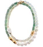 The Lizzie Fortunato Cabana Necklace features green jade, translucent beads, gold-plated accents, a white irregular-shaped bead, round pearls, and a gold toggle clasp.