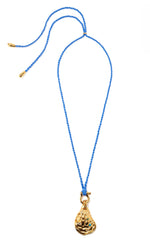 The Lizzie Fortunato Blue Point Necklace features a gold-plated oyster pendant with green semiprecious stones on a blue braided cord with gold-capped ends, shown against a white background.