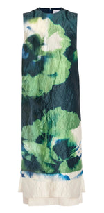 The Erdem Sleeveless Pencil Midi Dress showcases an abstract floral pattern in blue, green, and white on crinkled fabric with a carnation-like design.