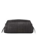 The Staud Maude Woven Soft Clutch is a rectangular black leather bag featuring side tassels and a signature knotted tie, shown against a white background.