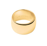 The Sandra Ring by Lie Studio features a wide, polished gold band with a smooth surface and engraved inner text, set against a plain white background—a timeless everyday piece you'll cherish.
