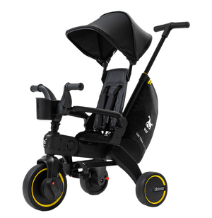 The Doona Liki Trike - Midnight Edition is a sleek black kids' tricycle with a canopy and push handle, ideal as a stroller alternative. This compact folding trike features three wheels and comes with a convenient storage bag.