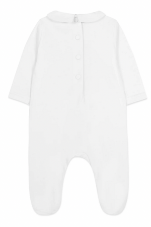 The Tartine et Chocolat Baby Pyjama Snowball Bunny Onesie is a cozy, white long-sleeve onesie with a collar and button-up back, crafted from 100% cotton—ideal for newborns seeking snuggly comfort.