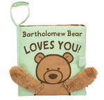 The Jellycat "Bartholomew Bear Loves You" book is a fabric children's book featuring Bartholomew Bear with vibrant colors and fuzzy arms on the cover, perfect for little hands to explore its tactile fabrics.