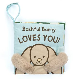 Jellycat's Bashful Bunny Loves You Book is a baby-friendly soft cloth book featuring an adorable bunny illustration with plush, gentle ears that little ones will adore.