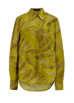 The Spence Shirt by Brandon Maxwell is a yellow silk crepe long-sleeve shirt, featuring a brown feather pattern and a button-down front with collar, offering a relaxed fit.