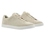 The Vantage Lite Suede Sneaker by Peter Millar, crafted from luxury beige suede, features a white EVA rubber outsole and is depicted from a slightly elevated angle.