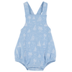 The Beaufort Bonnet Company Baby Stillman Sunsuit is a light blue romper with white sailboats, palm trees, and fish prints, featuring shoulder straps and elastic leg openings in the brand’s classic style.