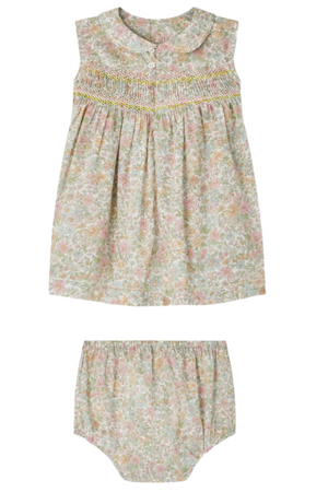 The Bonpoint Baby Girls' Eleanore Smocked Dress made with Liberty fabric features hand-embroidered smocking, a Peter Pan collar, and comes with matching elastic waist bloomers in a pastel floral print.